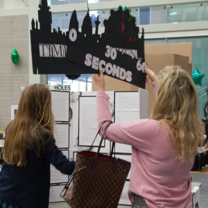 Student and parent setting up a project